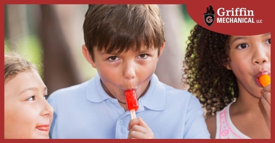 Children eating popsicles