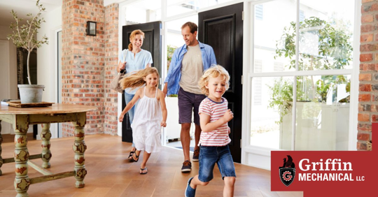 Family walking in house.